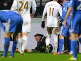 A ballboy lies on the grounf and reacts after a altercation with Chelsea's Belgium midfielder Eden Hazard during the English League Cup semi-final second leg football match between Swansea City and Chelsea at The Liberty stadium in Cardiff, south Wales on