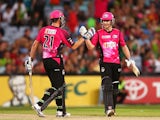 Moises Henriques and Nic Maddinson of the Sixers celebrate winning the Big Bash League match between Sydney Thunder and the Sydney Sixers at ANZ Stadium on January 25, 2014
