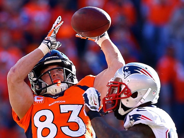 Wes Welker #83 of the Denver Broncos catches a second quarter pass over Kyle Arrington #25 of the New England Patriots during the AFC Championship game on January 19, 2014