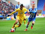 Marouane Chamakh of Crystal Palace is closed down by Ben Watson of Wigan Athletic during the Budweiser FA Cup fourth round match between Wigan Athletic and Crystal Palace at DW Stadium on January 25, 2014