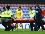 Jonathan Parr of Crystal Palace leaves the field on a stretcher during the Budweiser FA Cup fourth round match between Wigan Athletic and Crystal Palace at DW Stadium on January 25, 2014