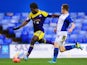 Wilfried Bony of Swansea shoots past Mitch Hancox of Birmingham during the FA Cup fourth round match on January 25, 2014