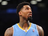 Wilson Chandler #21 of the Denver Nuggets looks on during the second quarter against the Brooklyn Nets at Barclays Center on December 3, 2013