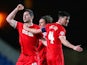 Yann Kermorgant of Charlton celebrates scoring their third goal with team mates during the FA Cup Third Round Replay match against Oxford United on January 21, 2014