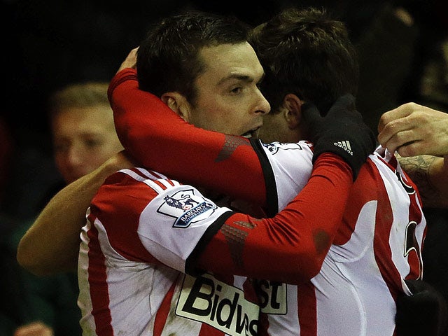 Sunderland's Adam Johnson celebrates with teammate Fabio Borini after scoring the opening goal against Stoke during their Premier League match on January 29, 2014