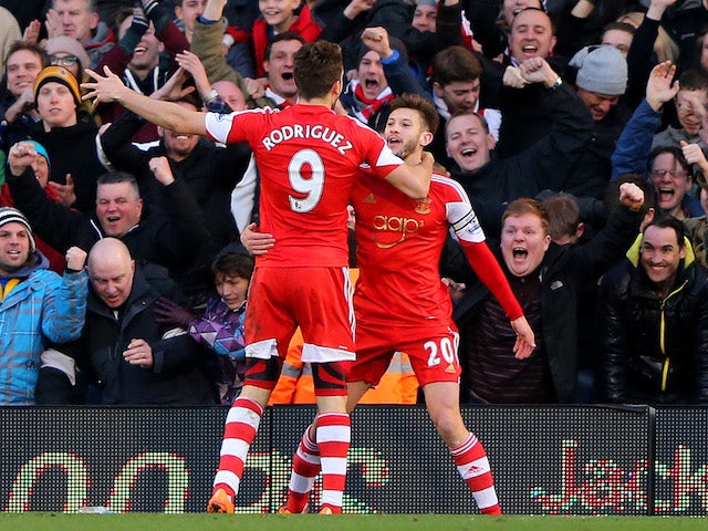 Adam Lallana (R) of Southampton celebrates with team-mate Jay Rodriguez of Southampton after scoring the opening goal during the Barclays Premier League match against Fulham on February 1, 2014