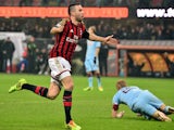 AC Milan's French defender Adil Rami celebrates after scoring a goal during the Serie A football match against Torino on February 1, 2014