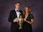 Andy Murray poses with the 2013 Wimbledon trophy along with his girlfriend Kim Sears during the Wimbledon Champions Dinner in Central London on July 7, 2013