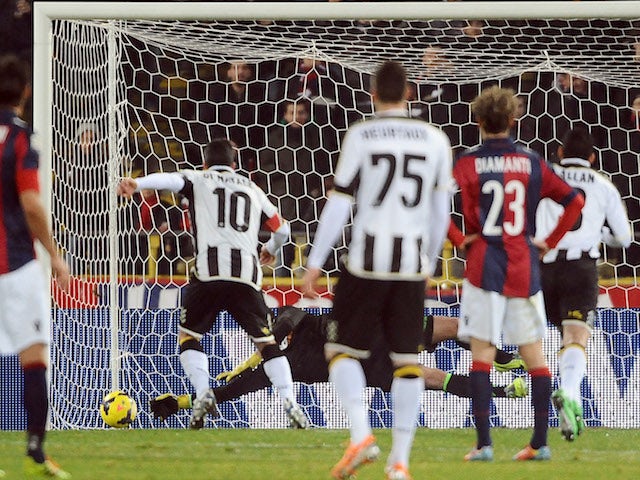 Antonio Di Natale of Udinese Calcio scores a goal from the penalty spot during the Serie A match against Bologna FC