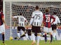 Antonio Di Natale of Udinese Calcio scores a goal from the penalty spot during the Serie A match against Bologna FC