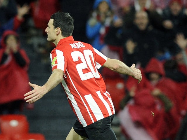 Athletic Club Bilbao's Aritz Aduriz celebrates after scoring the opening goal against Atletico Madrid during their Copa del Rey match on January 29, 2014