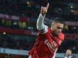 Arsenal's English midfielder Alex Oxlade-Chamberlain celebrates after scoring a goal during the English Premier League football match between Arsenal and Crystal Palace at the Emirates Stadium in London on February 2, 2014