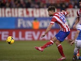 Atletico Madrid's Brazilian midfielder Diego scores during the Spanish league football match Club Atletico de Madrid vs Real Sociedad at the Vicente Calderon stadium in Madrid on February 2, 2014