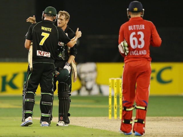 George Bailey and Cameron White of Australia celebrate their win during game two of the International Twenty20 series between Australia and England at the Melbourne Cricket Ground on January 31, 2014 