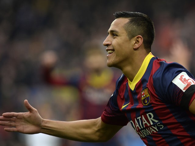 Barcelona's Chilean forward Alexis Sanchez celebrates after scoring a goal during the Spanish league football match FC Barcelona vs Valencia CF at the Camp Nou stadium in Barcelona on February 1, 2014