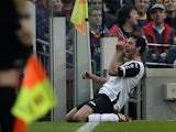 Valencia's midfielder Daniel Parejo celebrates after scoring the equalizer during the Spanish league football match FC Barcelona vs Valencia CF at the Camp Nou stadium in Barcelona on February 1, 2014