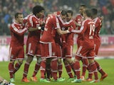 Bayern players celebrate their team's second goal during the German first division Bundesliga football match FC Bayern Munich vs Eintracht Frankfurt at the Allianz Arena in Munich, southern Germany on February 02, 2014