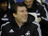 Swansea City's Danish manager Michael Laudrup gestures during the English FA Cup fourth round football match between Birmingham City and Swansea City at St Andrew's stadium in Birmingham on January 25, 2014