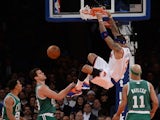 New York Knicks Kenyon Martin smashes the ball against Boston Celtics players during an NBA game at Madison Square Garden in New York, January 28, 2014