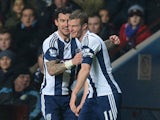 West Brom's Chris Brunt celebrates with teammate Liam Ridgewell after scoring the opening goal against Aston Villa during their Premier League match on January 29, 2014