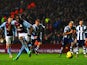 Aston Villa's Christian Benteke scores his team's fourth goal via the penalty spot against West Brom during their Premier League match on January 29, 2014