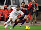 Daniele Dessena (R) of Cagliari and Anderson of Fiorentina compete for the ball during the Serie A match on February 1, 2014