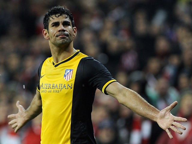 Atletico Madrid's Diego Costa celebrates after scoring his team's second goal against Athletic Bilbao during their Copa del Rey match on January 29, 2014