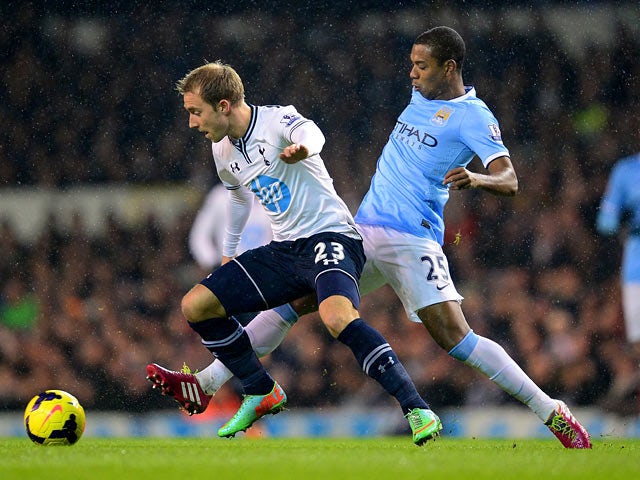 Man City's Fernandinho and Tottenham's Christian Eriksen in action during their Premier League match on January 29, 2014