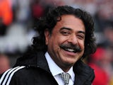 Fulham's Pakistani-born US owner Shahid Khan smiles before the English Premier League football match between Fulham and Arsenal at Craven Cottage in London on August 24, 2013