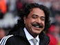 Fulham's Pakistani-born US owner Shahid Khan smiles before the English Premier League football match between Fulham and Arsenal at Craven Cottage in London on August 24, 2013