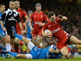 Wales' wing George North (R) is tackled by Italy's wing Angelo Espostio (L) during the Six Nations rugby union international tournament between Wales and Italy at the Millennium Stadium on February 1, 2014