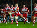 Ryan Mills of Gloucester feeds a pass during the International match between Gloucester and Japan at Kingsholm Stadium on November 12, 2013