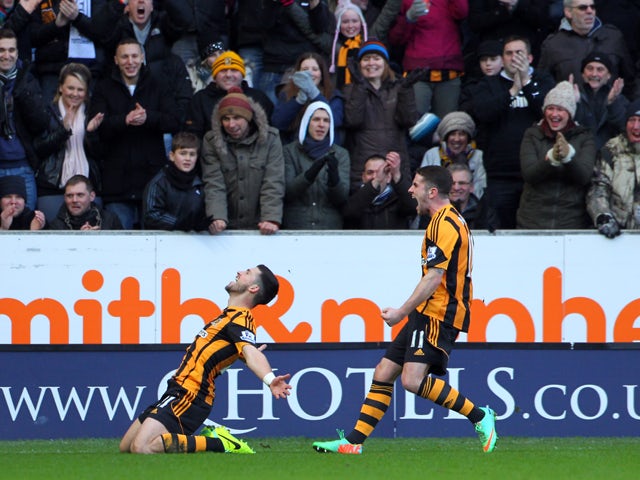 Shane Long of Hull City celebrates his debut goal with team-mate Robbie Brady during the Barclays Premier League match between Hull City and Tottenham Hotspur at KC Stadium on February 01, 2014