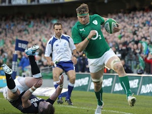 Ireland's no. 8 Jamie Heaslip evades a tackle from Scotland's full back Stuart Hogg during the Six Nations international rugby union match between Ireland and Scotland at the Aviva Stadium in Dublin on February 2, 2014