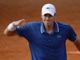 USA's John Isner celebrates his victory over Argentina's Carlos Berlocq at the end of their French Tennis Open first round match at the Roland Garros stadium in Paris, on May 27, 2013