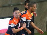 Montpellier's French midfielder Joris Marveaux (R) is congratulated by teammate French midfielder Remy Cabella (L) after scoring a goal during the French L1 football match against Reims on February 1, 2014