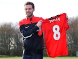 Juan Mata poses with his new #8 Manchester United shirt on January 27, 2014