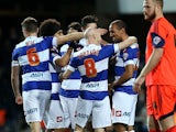 QPR's Karl Henry celebrates with teammates after scoring his team's second goal against Bolton during their Championship match on January 28, 2014