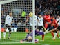 Kenwyne Jones of Cardiff City beats goalkeeper John Ruddy of Norwich City to score their second goal during the Barclays Premier League match on February 1, 2014