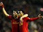 Daniel Sturridge of Liverpool is congratulated by teammate Luis Suarez after scoring his team's third goal during the Barclays Premier League match between Liverpool and Everton at Anfield on January 28, 2014