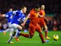 Luis Suarez of Liverpoolis pursued by James McCarthy of Everton during the Barclays Premier League match between Liverpool and Everton at Anfield on January 28, 2014
