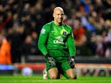 Dejected goalkeeper Tim Howard of Everton looks on during the Barclays Premier League match between Liverpool and Everton at Anfield on January 28, 2014