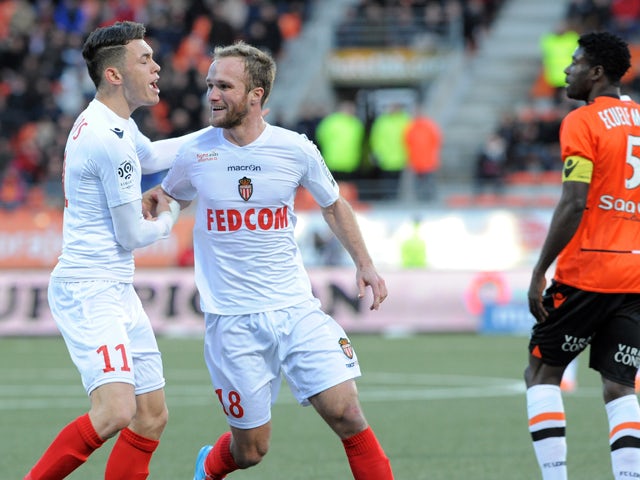 Monaco's France forward Valere Germain is congratulated by his teammate Argentinian midfielder Lucas Ocampos (L) after Germain scored an equalizer during the French L1 football match Lorient vs Monaco on February 1, 2014