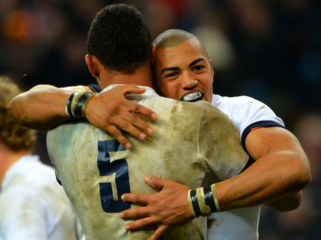 Luther Burrell of England celebrates his try with Courtney Lawes of England during the RBS Six Nations match between France and England at Stade de France on February 1, 2014