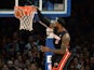 Miami Heat LeBron James slams the ball against the New York Knicks during their NBA game February 1, 2014