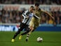 Sylvain Marveaux of Newcastle United evades Alex Mowatt of Leeds United during the Capital One Cup Third Round match between Newcastle United and Leeds United at St James' Park on September 25, 2013