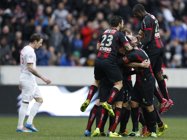 Nice's players celebrate after scoring during the French L1 football match Nice (OGC Nice) vs Lille (LOSC) on February 2, 2014