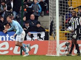 Manchester City's Edin Dzeko celebrates after scoring against Notts County during their English FA Cup football match at Meadow Lane in Nottingham, central England, on January 30, 2011