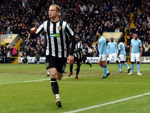 Notts County's English midfielder Neal Bishop celebrates after scoring the opening goal against Manchester City during their English FA Cup football match at Meadow Lane in Nottingham, central England, on January 30, 2011