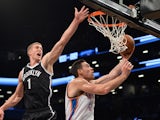 Nick Collison of the Oklahoma City Thunder drives against Mason Plumlee of the Brooklyn Nets during their NBA game January 31, 2014